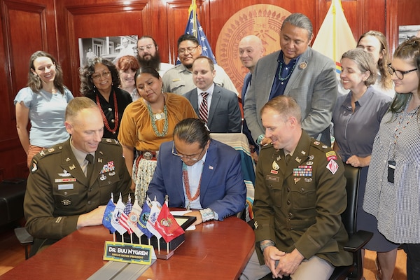 Navajo Nation President Buu Nygren, center, and U.S. Army Corps of Engineers Los Angeles District Commander Col. Andrew Baker, center left, sign an agreement for a $3 million feasibility study for the Birdsprings Flood-Risk Mitigation project June 1 in Window Rock, Arizona