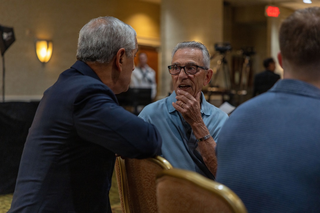 A family member speaks to Kelly McKeague, Defense POW/MIA Accounting Agency director, during the 2026 Vietnam War Annual Government Briefing in Arlington, Virginia