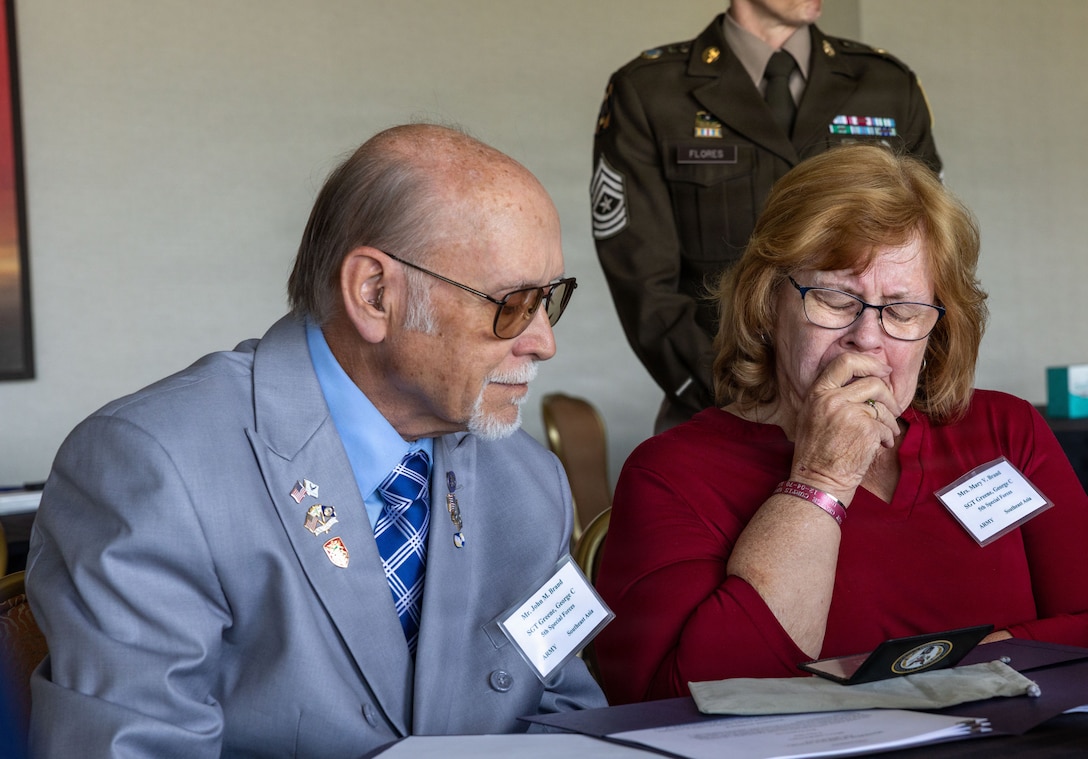 John Brand and Mary Brand, next of kin to U.S. Army Sgt. George Greene, receive his identification card during the 2026 Vietnam War Annual Government Briefing in Arlington, Virginia