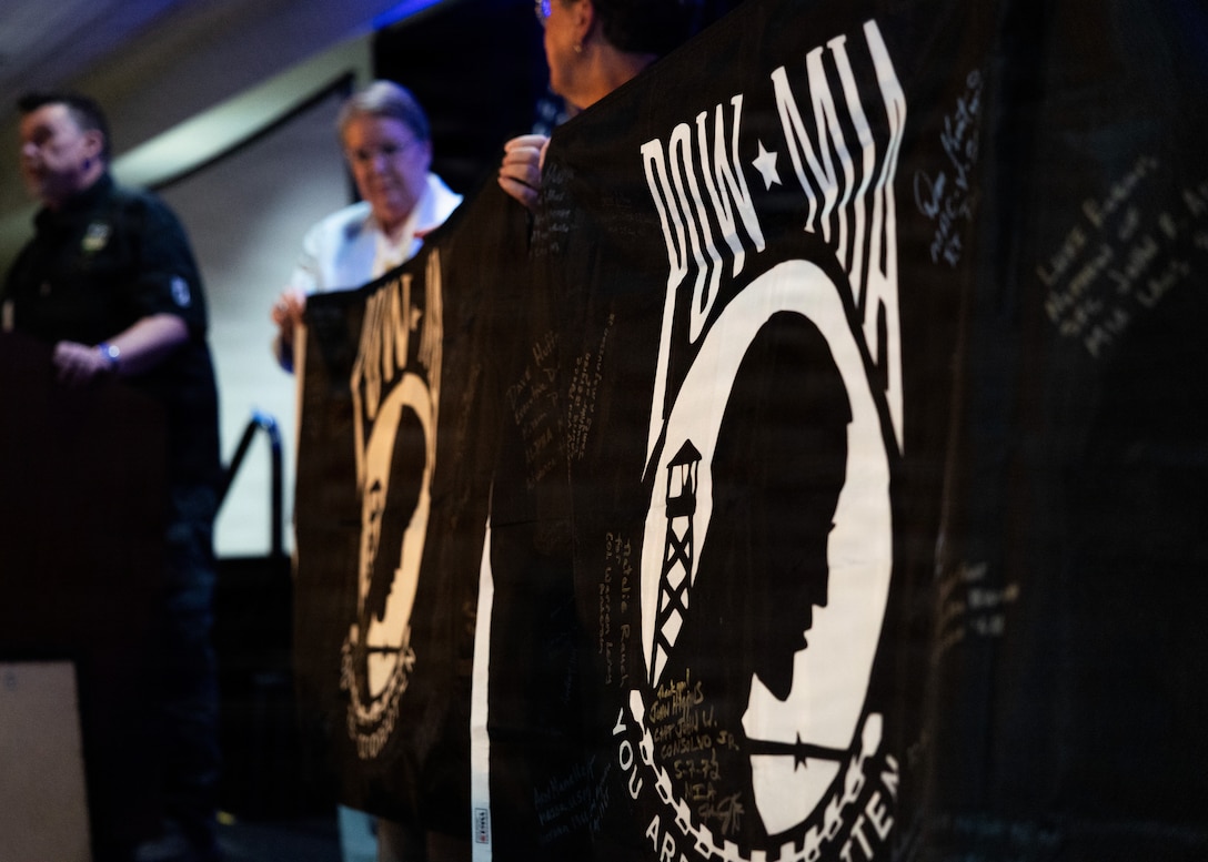 Signed POW/MIA flags from Joint Field Activity teams are presented to Gold Star families during day two of the Vietnam Annual Government Briefing hosted by the Defense POW/MIA Accounting Agency