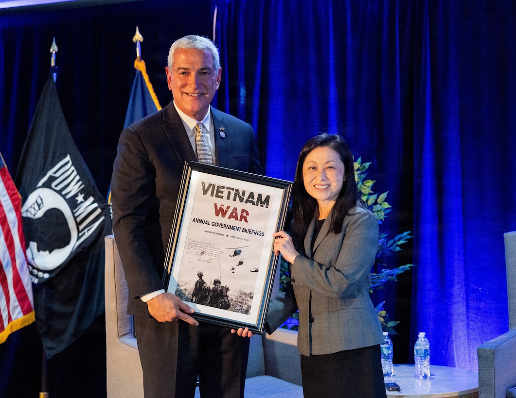 Kelly McKeague, Defense POW/MIA Accounting Agency director, left, presents a plaque to the Hon. Jennifer Wicks, U.S. Ambassador to Vietnam