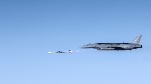 A YFQ-44A Collaborative Combat Aircraft fires an AIM-120 weapon in secluded airspace over the Mojave Desert. The live-fire test of the YFQ-44 aircraft is the latest milestone in the rapid development of safe and effective CCA operations. (U.S. Air Force photo by Jennifer Healy)