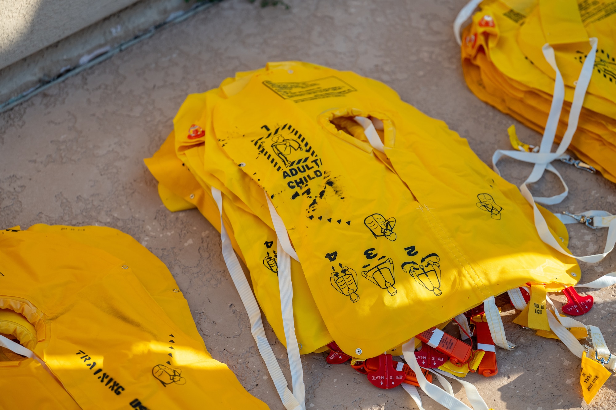An inflatable life preserver is displayed during Water Survival Training at Altus AFB, Oklahoma, July 10, 2026. During the entirety of the hands-on portion of the training, Airmen wore inflatable life preservers. (U.S. Air Force photo by Airman 1st Class Emma Wright)