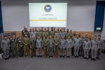 Service members from the U.S. Navy, U.S. Coast Guard, Royal Canadian Navy, and Royal Thai Navy pose for a group photo during the closing ceremony of exercise Cooperation Afloat Readiness and Training (CARAT) Thailand 2026.