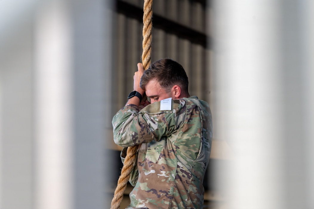 U.S. Air Force Senior Airman Evan Cantrell, 703rd Munitions Support Squadron electronic security systems program monitor, performs a rope climb during the 435th Security Forces Squadron Air Assault assessment on Ramstein Air Base, Germany, July 9, 2026.
