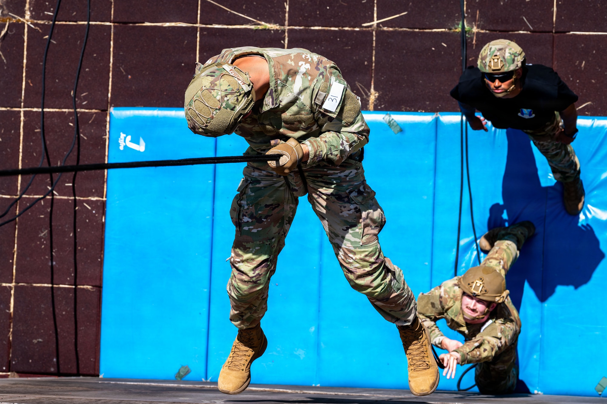U.S. Air Force Senior Airman Saul Almanza, 703rd Munitions Support Squadron counter-small unmanned aircraft systems program manager, rappels down a wall during the 435th Security Forces Squadron Air Assault assessment at U.S. Army Garrison Baumholder, Germany, July 9, 2026.