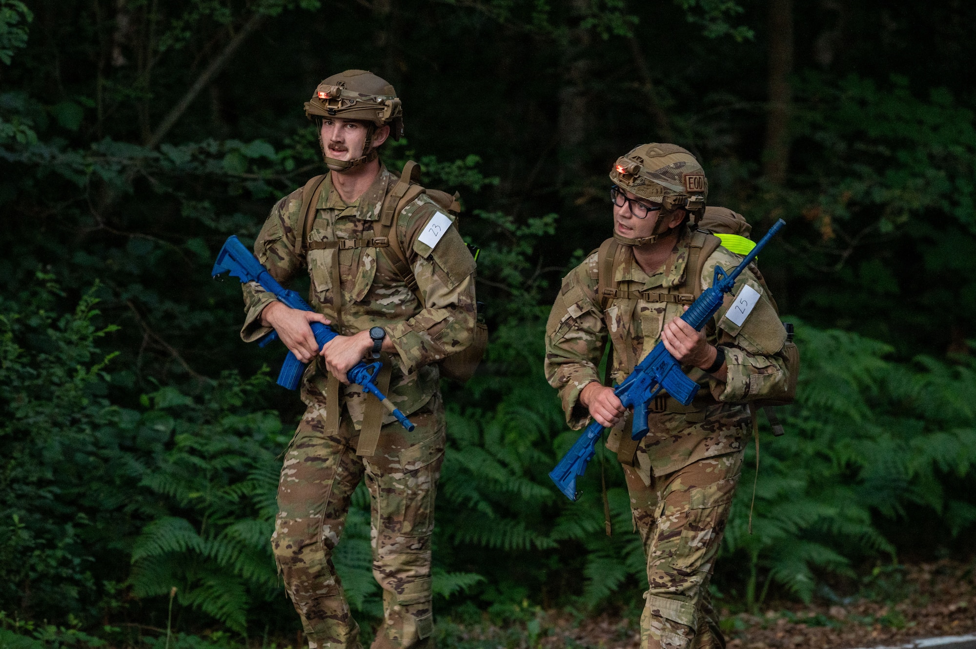 U.S. Air Force Senior Airman William Martin and Senior Airman Sebastien-Thomas Fredericks, 52nd Civil Engineer Squadron explosive ordnance disposal journeymen, perform a 12-mile ruck march during the 435th Security Forces Squadron Air Assault assessment at Ramstein Air Base, Germany, July 10, 2026.