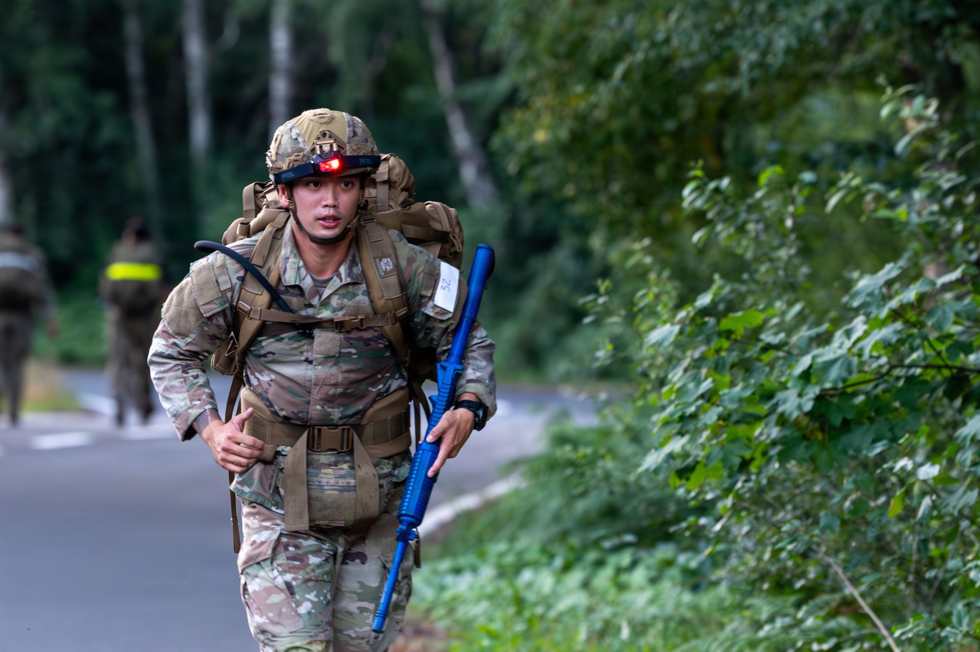 U.S. Air Force Senior Airman Logan Mew, 435th Security Forces Squadron contingency response team member, performs a 12-mile ruck march during the 435th Security Forces Squadron Air Assault assessment at U.S. Army Garrison Baumholder, Germany, July 9, 2026..