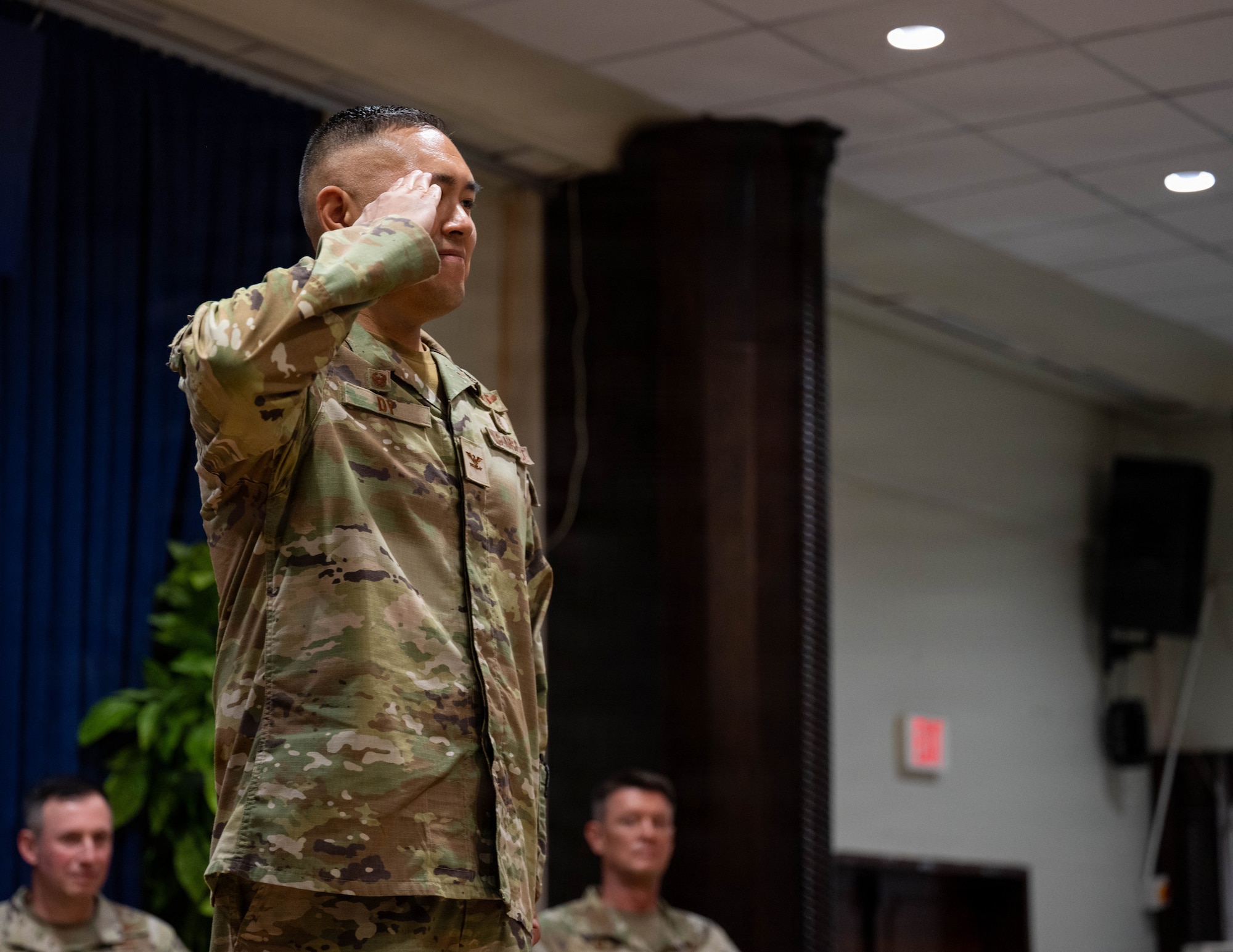 U.S. Air Force Col. David Dy, 39th Medical Group incoming commander, returns a salute.