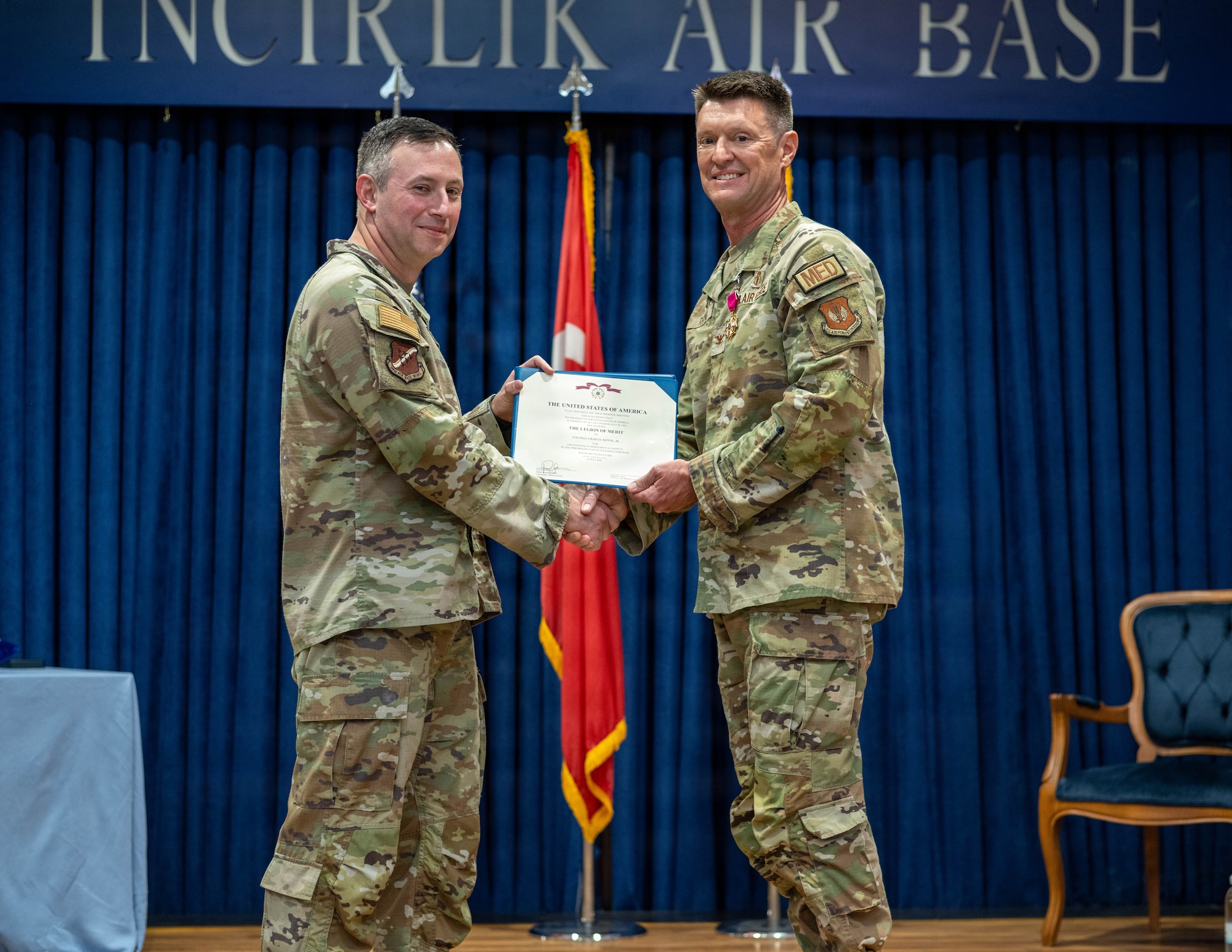 U.S. Air Force Col. Isaac Adams, 39th Air Base Wing commander, presents the Legion of Merit medal to Col. Craig Rhyne, 39th Medical Group outgoing commander,