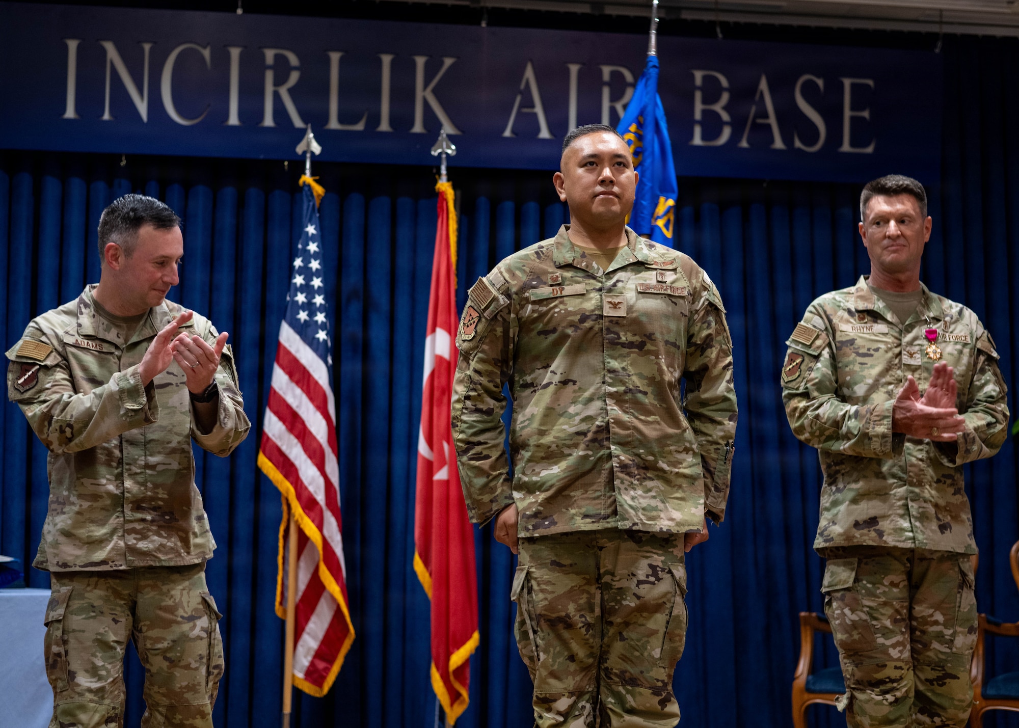 U.S. Air Force Col. Isaac Adams, 39th Air Base Wing commander, Col. David Dy, 39th Medical Group incoming commander, and Col. Craig Rhyne, 39th MDG outgoing commander, celebrate.