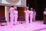 Lt. Cmdr. Alex R. Stulo (left) and Cmdr. William “PJ” Martin (right) salute one another during a change of charge ceremony for Navy Medicine Readiness and Training Unit China Lake at Naval Air Weapons Station China Lake, California, July 10, 2026. (U.S. Navy photo by NAWS China Lake public affairs).