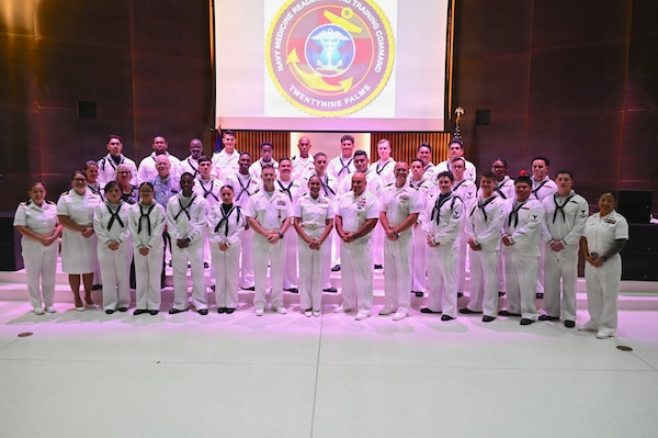 Distinguished guests gather for a group photo during the Navy Medicine Readiness and Training Unit China Lake change of charge ceremony at Naval Air Weapons Station China Lake, California, July 10, 2026, celebrating the transfer of leadership from Cmdr. William “PJ” Martin to Lt. Cmdr. Alex R. Stulo. (U.S. Navy photo by NAWS China Lake public affairs).