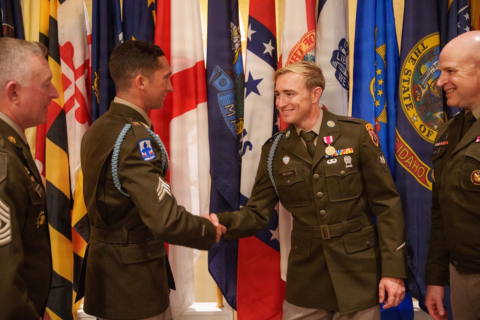 U.S. Army Spc. Brandon Brown, right, representing the Florida Army National Guard, and U.S. Army Sgt. Michael Fouts, representing the Arizona Army National Guard, congratulate each other after Fouts was named the 2026 Army National Guard Noncommissioned Officer of the Year and Brown was named 2026 Army National Guard Soldier of the Year during the Army National Guard Best Warrior Competition awards ceremony at Camp Blanding Joint Training Center, Fla., July 14, 2026.