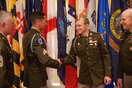 U.S. Army Spc. Brandon Brown, right, representing the Florida Army National Guard, and U.S. Army Sgt. Michael Fouts, representing the Arizona Army National Guard, congratulate each other after Fouts was named the 2026 Army National Guard Noncommissioned Officer of the Year and Brown was named 2026 Army National Guard Soldier of the Year during the Army National Guard Best Warrior Competition awards ceremony at Camp Blanding Joint Training Center, Fla., July 14, 2026.