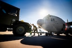 U.S. Air Force Master Sgt. Nathaniel Sobieski, a crew chief assigned to the 153rd Airlift Wing, Wyoming Air National Guard, adjusts tow equipment on a C-130 Hercules aircraft at Cheyenne Air National Guard Base, Wyoming, July 14, 2026.