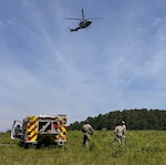 Fort Pickett Fire and Emergency Services personnel, as well as personnel from several other garrison directorates and state and local partner agencies combine forces to execute complex, high-risk rescue operations after several paratroopers became stuck in trees July 10, 2026, at Fort Pickett, Virginia.