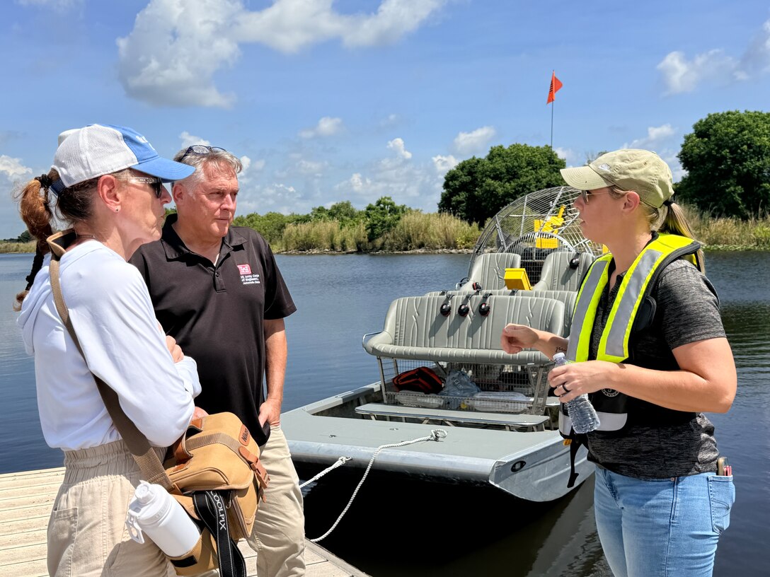 Martin and Lane talk aquatic invasives with Lake Okeechobee News reporter Katrina Elsken (left) on the bank of Lake Okeechobee at the conclusion of the media event and airboat tour. The media day provided a closer look at how management decisions are made, what crews encounter on the water, and how the district continues to adapt and improve its approach alongside its partners.