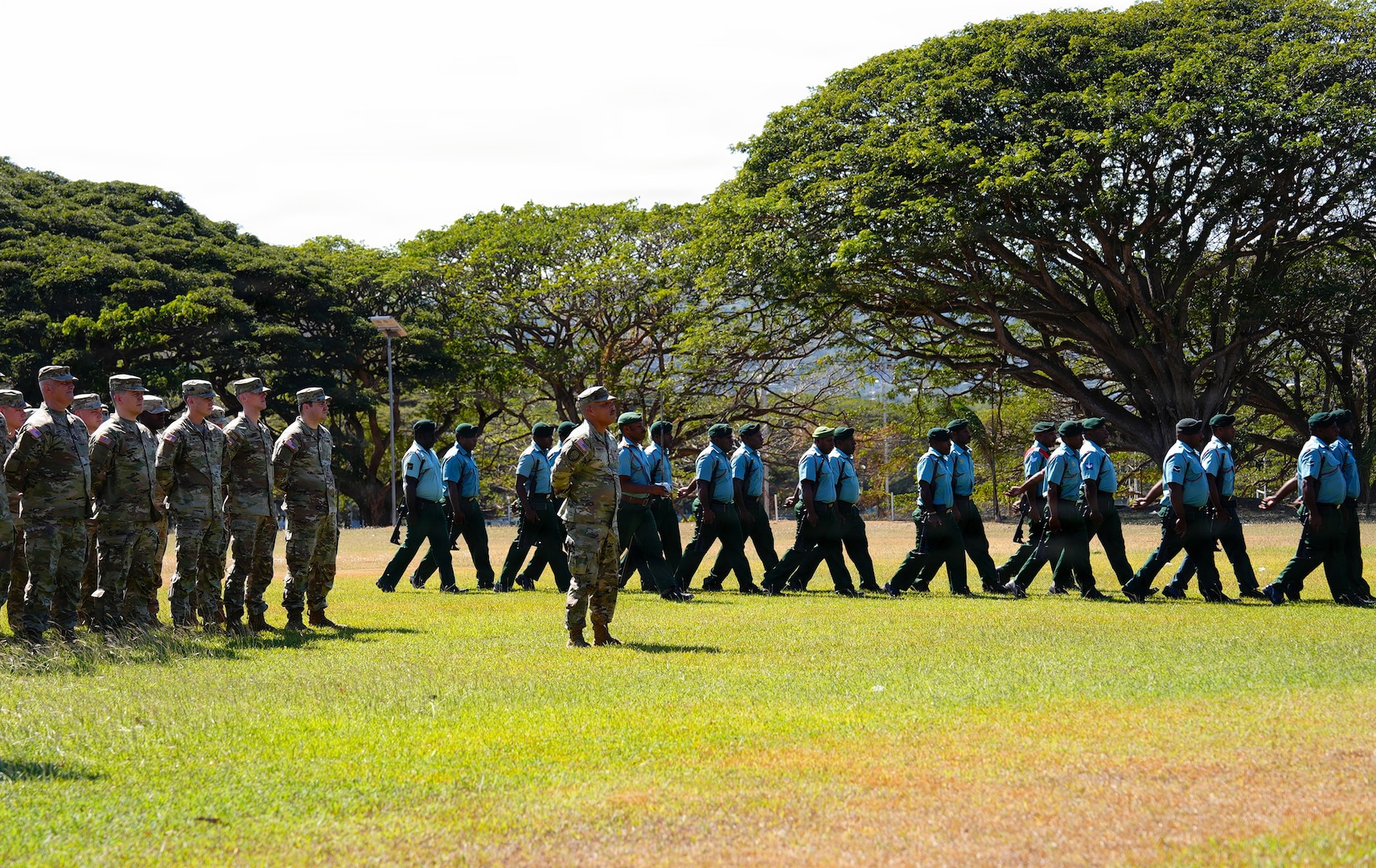 U.S. Army Soldiers from the Wisconsin National Guard stand at parade rest while members of the Papua New Guinea Defence force march onto the field during the opening ceremony of Exercise Tamiok Strike 26 at Murray Barracks, Port Moresby, Papua New Guinea, July 13, 2026.