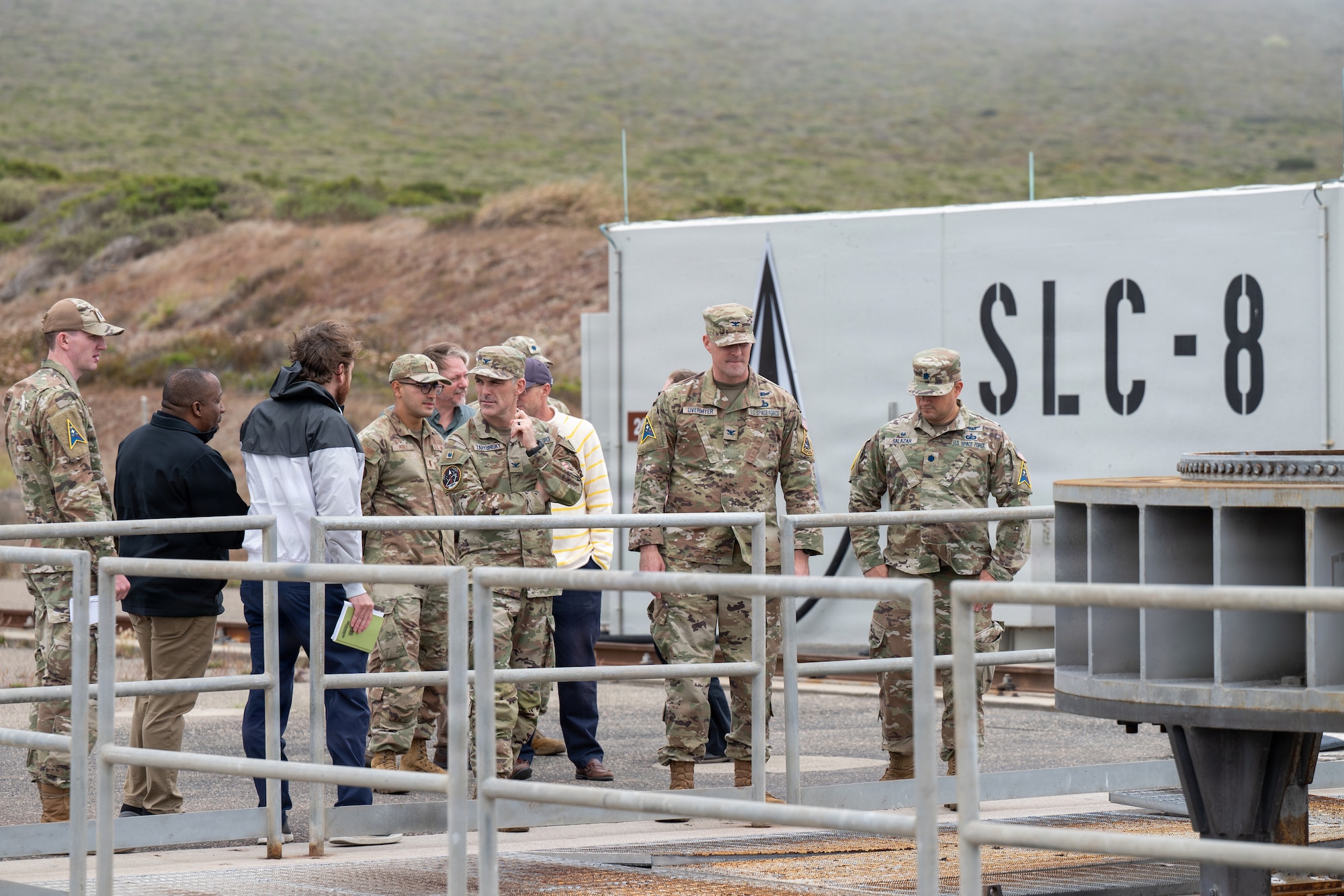 People gather near a launch pad.
