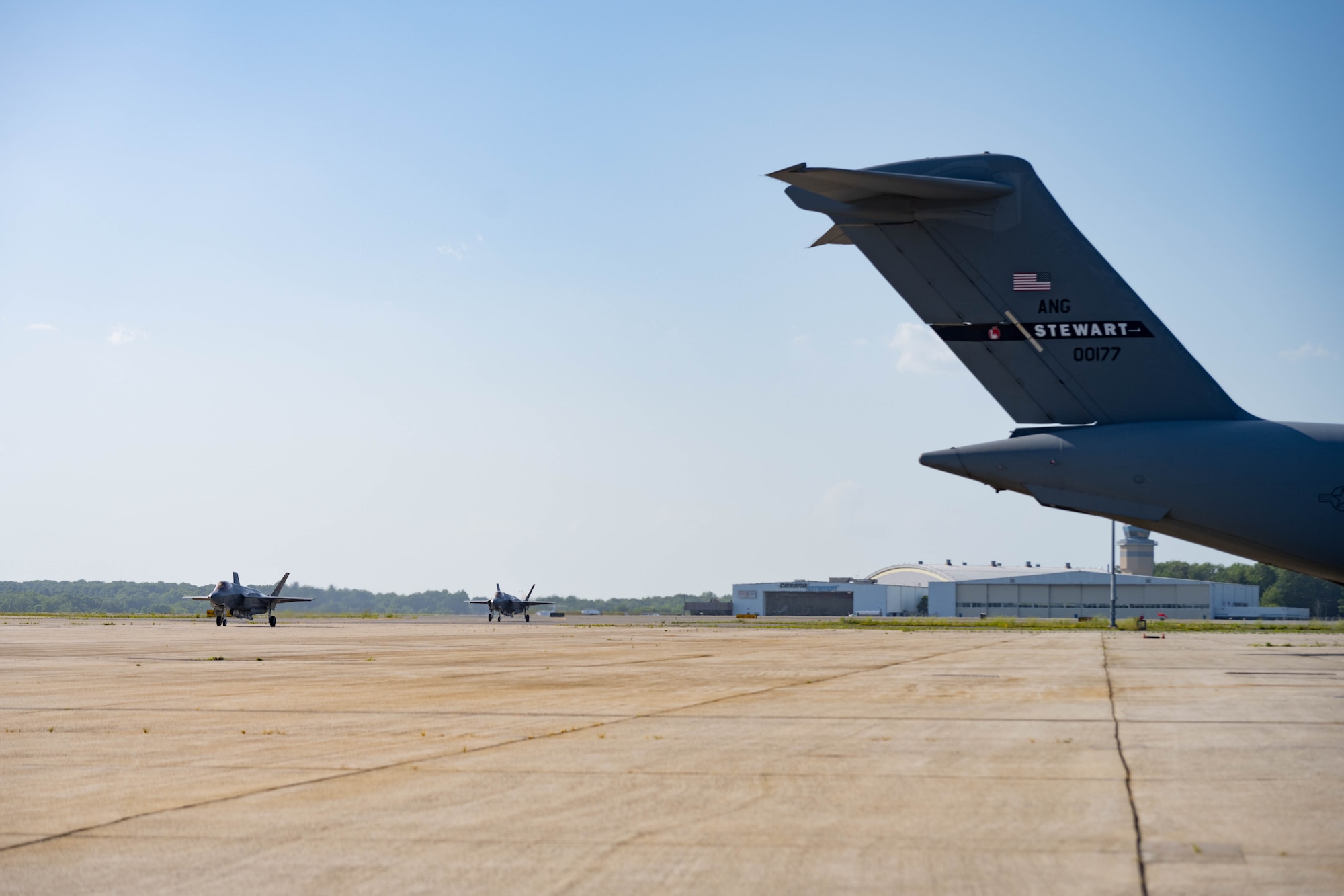 Two F-35 Lightning IIs from the Italian Air Force taxi onto the flightline.