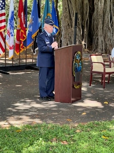 An Air Force major general speaks at a podium.