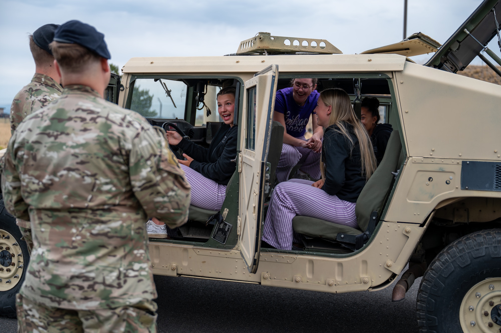 Members of the Lilac Festival Royal Court sit inside of a Humvee at Fairchild Air Force Base, Washington, July 14, 2026. The visit strengthened the wing’s partnership with an organization dedicated to community service, youth leadership, and honoring the military, fostering greater understanding of Fairchild’s mission and its impact on the Inland Northwest. (U.S. Air Force photo by Airman 1st Class Gabriel Conley)