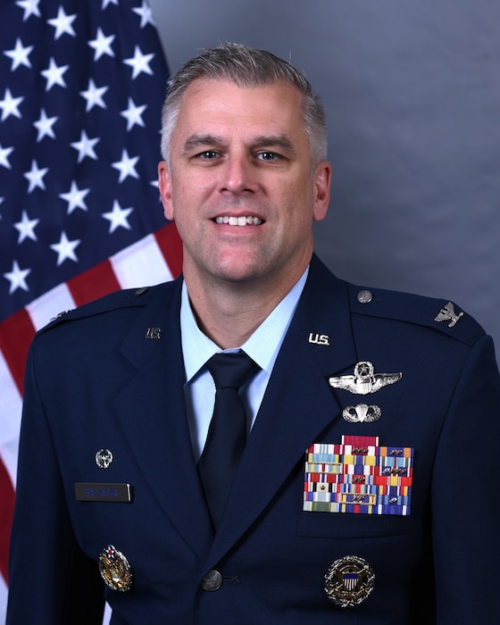A male Air Force officer in a service dress uniform.