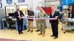 Figure 1: Pictured left to right, Troy Pierson, Director, MADMAN Repair Center, Scott Gamble, Mechanical and Materials Rapid Prototype Branch Manager, Jeff Campbell, NAVSEA 05T1, Cold Spray Project Manager, Capt. Boonyobhas, NSWC Crane Commanding Officer, and Dr. Werner, NSWC Crane Deputy Technical Director.