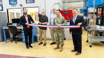 Figure 1: Pictured left to right, Troy Pierson, Director, MADMAN Repair Center, Scott Gamble, Mechanical and Materials Rapid Prototype Branch Manager, Jeff Campbell, NAVSEA 05T1, Cold Spray Project Manager, Capt. Boonyobhas, NSWC Crane Commanding Officer, and Dr. Werner, NSWC Crane Deputy Technical Director.