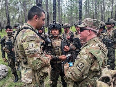 Virginia Army National Guard Soldiers assigned to the Staunton-based 116th Mobile Brigade Combat Team, Arkansas National Guard Soldiers and Guatemalan service members partnered with Arkansas through the Department of War National Guard Bureau State Partnership Program move into the field June 8, 2026, during a training rotation at the Joint Readiness Training Center, or JRTC, at Fort Polk, Louisiana.