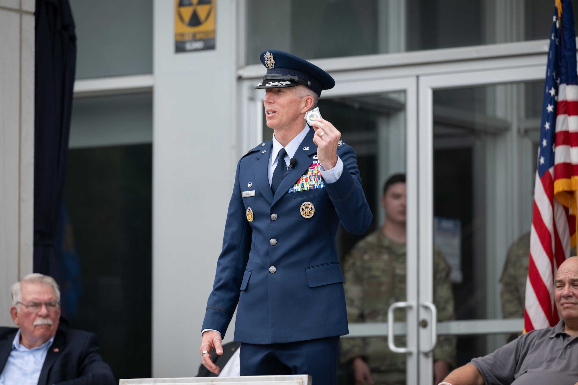 Outgoing Arnold Engineering Development Complex Commander Col. Grant Mizell prepares to place the current AEDC Commander’s Coin into a time capsule unveiled June 27, 2026, during the AEDC 75th anniversary open house celebration at Arnold Air Force Base, Tenn., headquarters of AEDC. Mizell also placed into the time capsule a letter detailing current challenges and initiatives undertaken recently to help guide the future of the Complex. (U.S. Air Force photo by Keith Thornburgh)