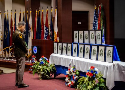 U.S. Army Aviation and Missile Command Chaplain Lt. Col. Geun Lee pauses in reflection during the AMCOM Memorial Service July 14, 2026, in the Bob Jones Auditorium on Redstone Arsenal, Alabama. The ceremony provided family members, friends and coworkers an opportunity to honor and remember 15 members of the AMCOM team who passed away during the past year.