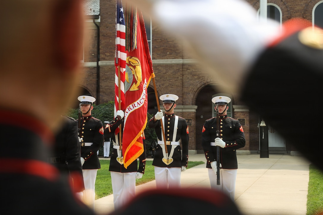 U.S. Marines with the Official United States Marine Corps Color Guard present the colors during a change of command ceremony at Marine Barracks Washington, D.C., July 16, 2026. The ceremony included the passing of the organizational colors from the outgoing to the incoming commander, symbolizing the transfer of authority, responsibility, and accountability for the command, and featured marching and musical elements from Marine Barracks Washington. The ceremony took place as the “Oldest Post of the Corps” celebrates 225 years since its founding, a milestone that falls during America's 250th anniversary of independence and just one year after the Marine Corps 250th birthday. (U.S. Marine Corps photo by Cpl. Brynn L. Bouchard)