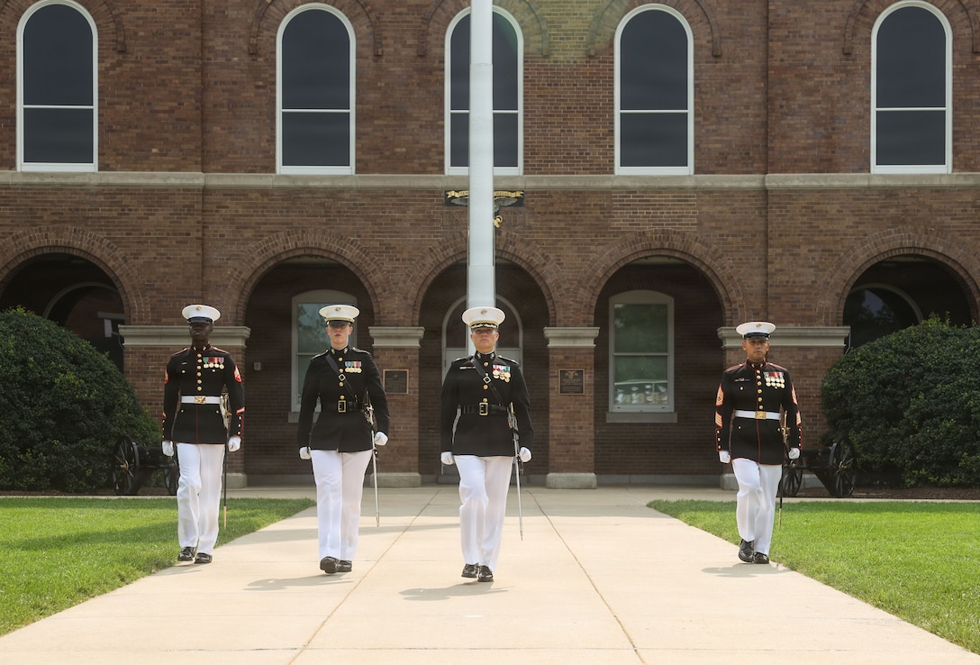 U.S. Marines with the Marine Barracks Washington parade staff execute “march on“ during a change of command ceremony at Marine Barracks Washington, D.C., July 16, 2026. The ceremony included the passing of the organizational colors from the outgoing to the incoming commander, symbolizing the transfer of authority, responsibility, and accountability for the command, and featured marching and musical elements from Marine Barracks Washington. The ceremony took place as the “Oldest Post of the Corps” celebrates 225 years since its founding, a milestone that falls during America's 250th anniversary of independence and just one year after the Marine Corps 250th birthday.  (U.S. Marine Corps photo by Cpl. Brynn L. Bouchard)