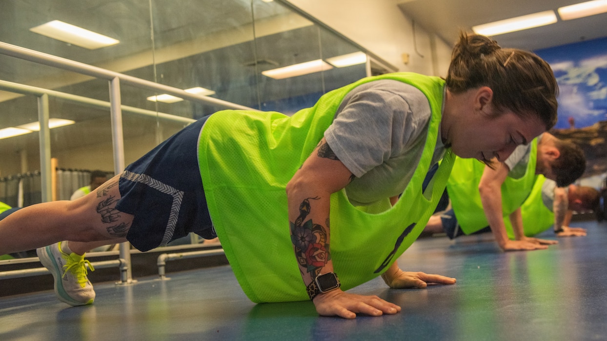 Airmen perform push-ups