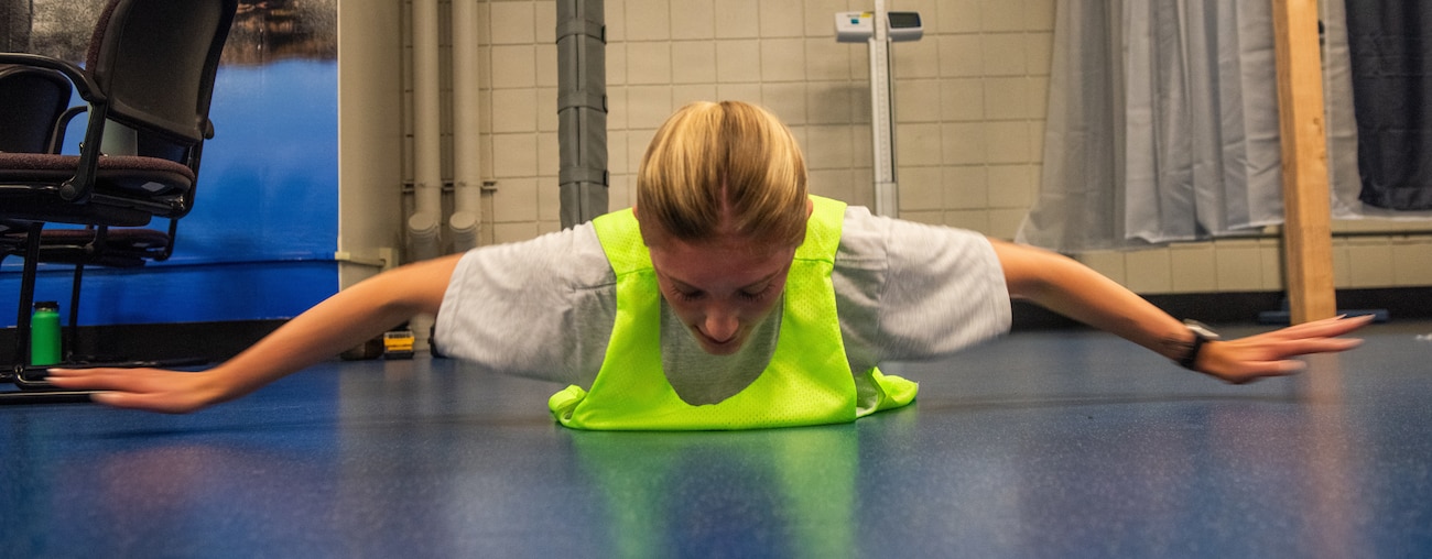 Airman performs hand release push-ups
