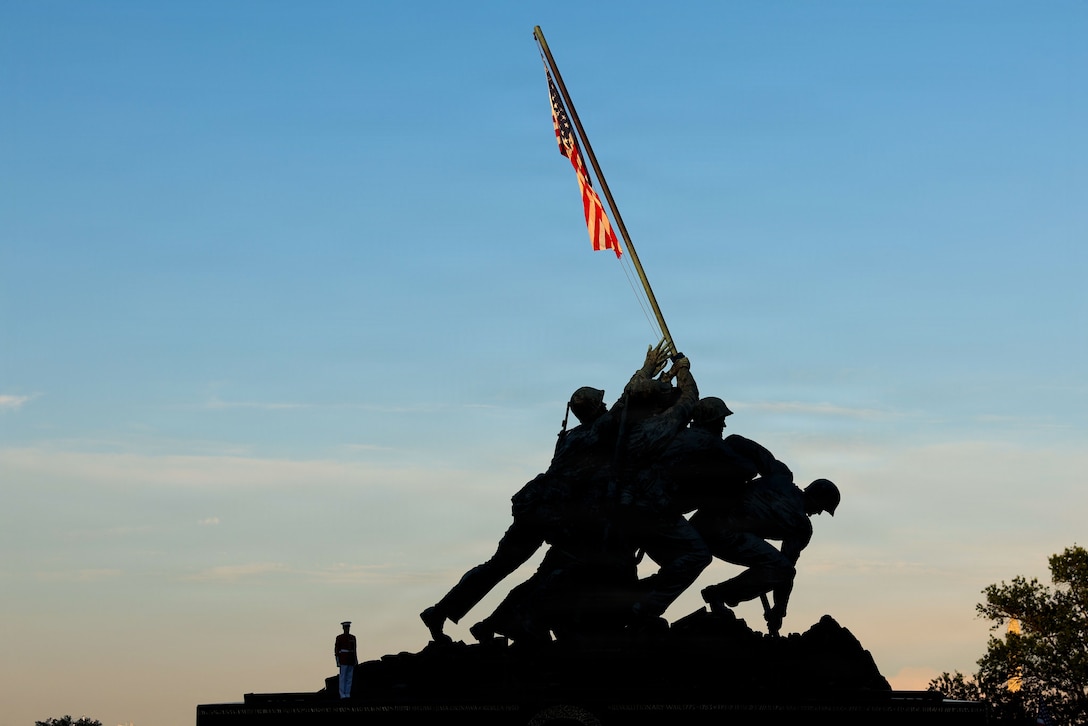 U.S. Marine Corps Sgt. Michael Rosie, ceremonial bugler, "The Commandant's Own” United States Marine Drum & Bugle Corps, Marine Barracks Washington, renders "taps" during the Sunset Parade at the United States Marine Corps War Memorial, Arlington, Virginia, June 23, 2026. His Excellency Jose Manuel Romualdez, Ambassador of the Republic of the Philippines to the United States of America served as the guest of honor, with Mr. James B. Balocki, executive director, Marine Corps Installations Command, hosting the Sunset Parade. Sunset Parades held by 8th & I reflect the legacy of Marines and the enduring standard of honor, courage, and commitment represented by Marines at the “Oldest Post of the Corps.” (U.S. Marine Corps photo by Cpl. Christopher Prelle)