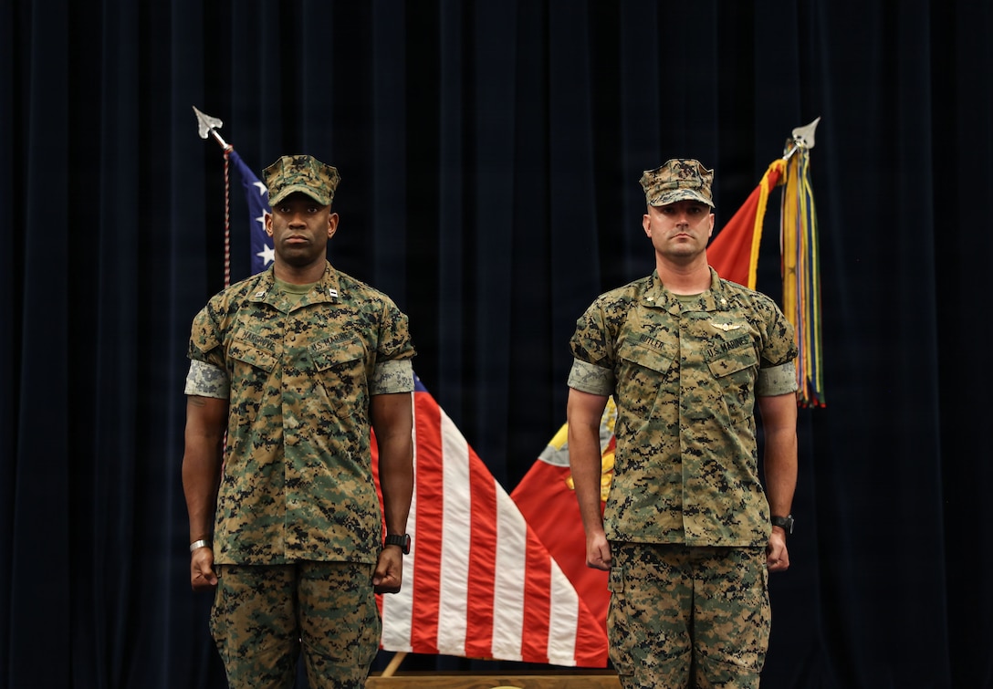 U.S. Marine Corps Capt. Cedric K. Hargrove Jr., left, company commander for Headquarters and Service Company, stands at attention with incoming company commander, Maj. William Butler, during a change of command ceremony at Marine Barracks Washington, D.C., July 1, 2026. Butler relieved Hargrove, whose future assignment will serve as the 3rd Landing Support Battalion's landing support company commander in Okinawa, Japan. (U.S. Marine Corps photo by Cpl. Brynn L. Bouchard)