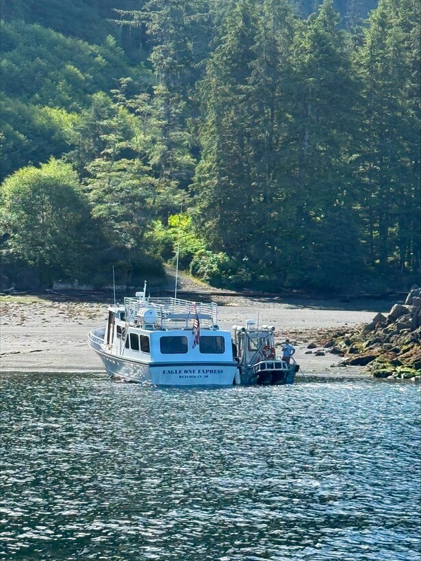 The motor vessel Eagle One Express (left) is beached alongside a good Samaritan vessel at Annette Island, Alaska, July 16, 2026. Four good Samaritan vessel crews responded to an Urgent Marine Information Broadcast to assist in the transportation of 36 passengers to Ketchikan.