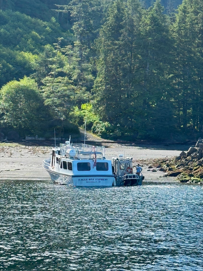 The motor vessel Eagle One Express (left) is beached alongside a good Samaritan vessel at Annette Island, Alaska, July 16, 2026. Four good Samaritan vessel crews responded to an Urgent Marine Information Broadcast to assist in the transportation of 36 passengers to Ketchikan.
