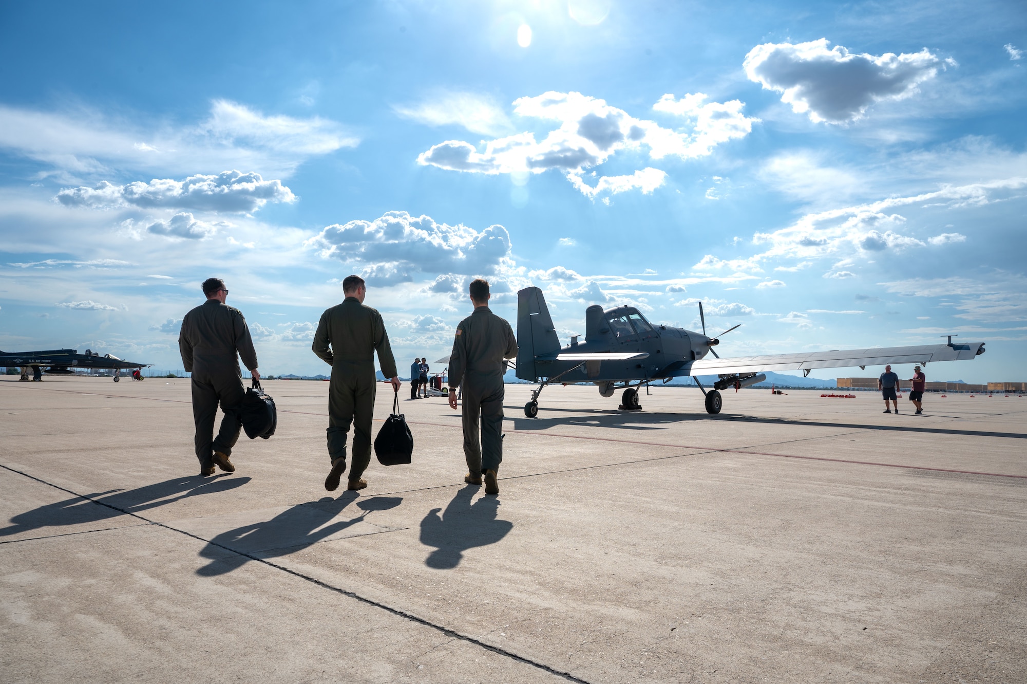 U.S. Air Force Col. Kyle Porter, 355th Wing deputy commander, and aircrew assigned to the 492nd Special Operations Wing approach an OA-1K Skyraider II aircraft at Davis-Monthan Air Force Base, Arizona, July 14, 2026. The knowledge and experience
gained during the familiarization flight ensures Porter can effectively support the 492nd SOW in his role as deputy commander. (U.S. Air Force photo by Senior
Airman Jasmyne Bridgers-Matos)