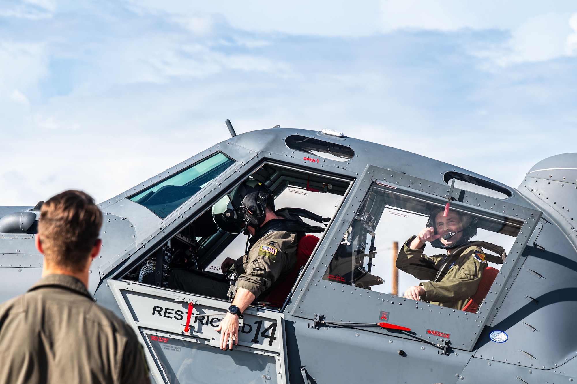 U.S. Air Force Col. Kyle Porter, 355th Wing deputy commander, closes the door of an OA-1K Skyraider II aircraft assigned to the 492nd Special Operations Wing at Davis-Monthan Air Force Base, Arizona, July 14, 2026. Porter participated in a familiarization flight to gain a better understanding of the OA-1K’s capabilities. (U.S. Air Force photo by Senior Airman Jasmyne Bridgers-Matos)