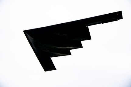 A B-2 Spirit assigned to the 509th Bomb Wing flies overhead at RAF Fairford, England, Aug. 25, 2021. The B-2 flyover was part of a Bomber Task Force mission in which aircraft conduct theater and flight training across Europe and Africa. The BTF missions, which have been occurring since 2018, provide theater familiarization for aircrew members and opportunities for U.S. integration with NATO allies and regional partners. The bomber missions enhance readiness and provide the training necessary to respond to any potential crisis or challenge across the globe. (U.S. Air Force photo by Senior Airman Eugene Oliver)
