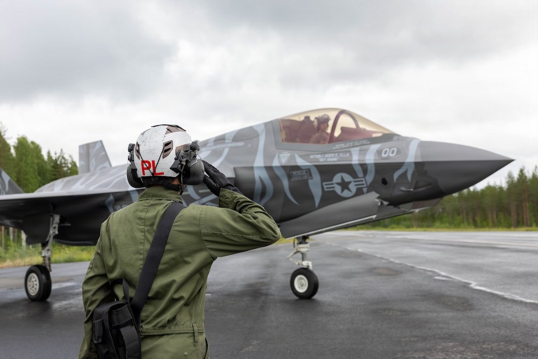 U.S. Marine Corps Cpl. Keng Lee, from Wisconsin, a powerline mechanic with Marine Fighter Attack Squadron (VMFA) 224, Marine Aircraft Group 31, 2nd Marine Aircraft Wing, salutes Maj. Danny Sorrells, from Georgia, an F-35B Lightning II pilot with VMFA-224, during exercise Ramstein Flag 2026 in Tervo, Finland, June 10, 2026. The F-35 serves as a versatile asset in support of expeditionary and rapid deployment operations, displaying U.S. capabilities alongside NATO allies throughout RAFL26. RAFL26 is NATO’s premier multi-domain tactical exercise involving 19 nations and over 15 operational locations. The exercise provides realistic combat scenarios in complex environments and is designed to enhance the Alliance’s deterrence and collective defense. (U.S. Marine Corps photo by Cpl. Mya Seymour)