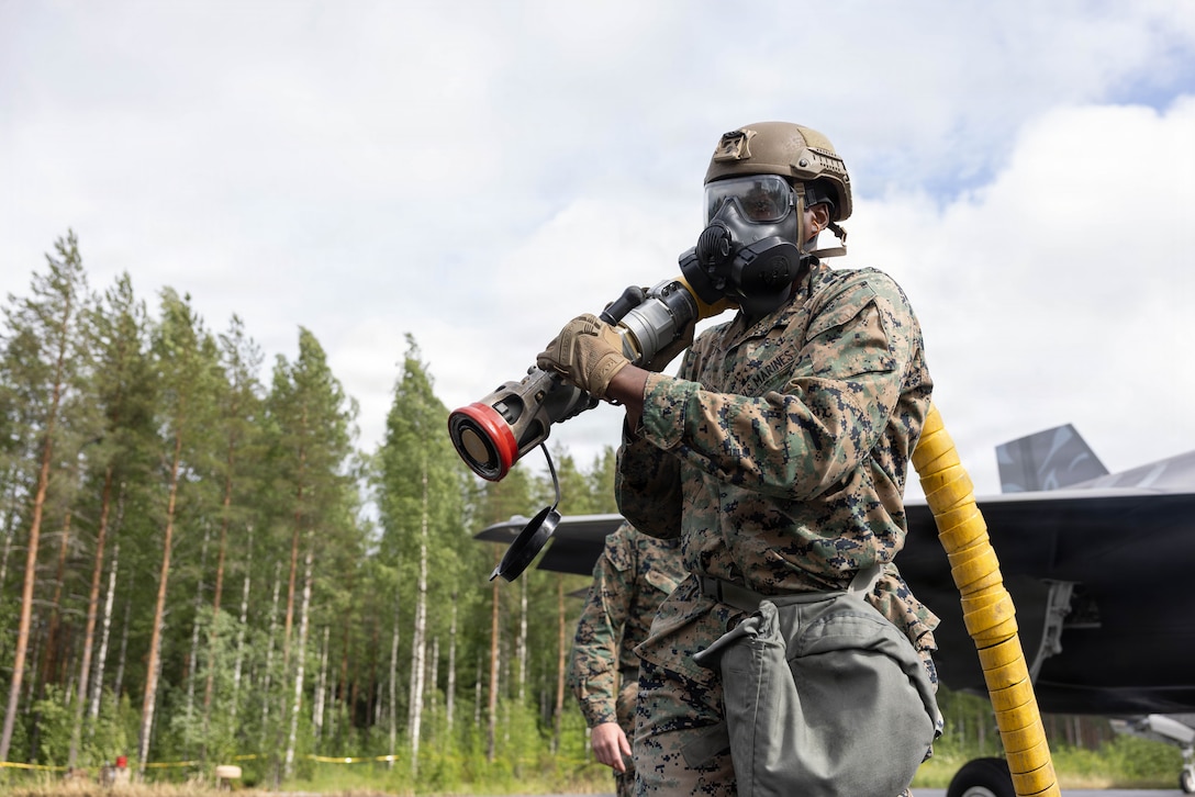 U.S. Marine Corps Lance Cpl. Jaheim Elrasul, from New York, an expeditionary fuels technician with Marine Wing Support Squadron (MWSS) 272, Marine Air Control Group 28, 2nd Marine Aircraft Wing, conducts forward arming and refueling point operations in a simulated chemical biological radiological and nuclear environment during exercise Ramstein Flag 2026 in Tervo, Finland, June 10, 2026. RAFL26 is NATO’s premier multi-domain tactical exercise involving 19 nations and over 15 operational locations. The exercise provides realistic combat scenarios in complex environments and is designed to enhance the Alliance’s deterrence and collective defense. (U.S. Marine Corps photo by Cpl. Mya Seymour)