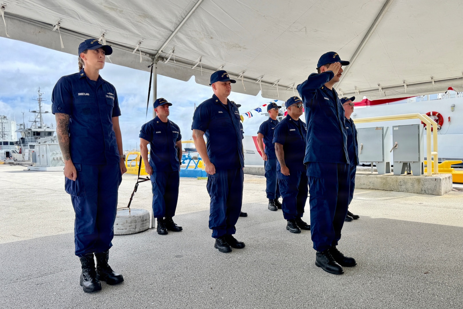 Lt. Drew Lovullo assumes command of USCGC Myrtle Hazard (WPC 1139) from Lt. Emma Saunders in a change of command ceremony on Victor Wharf in Guam on July 17, 2026. Capt. Jessica Worst, commander of U.S. Coast Guard Forces Micronesia/Sector Guam, presided over the ceremony. Under Saunders' command, Myrtle Hazard’s crew recently delivered roughly 20,000 pounds of relief supplies to five islands across the Commonwealth of the Northern Mariana Islands after Super Typhoon Sinlaku, carrying the mayor of Agrihan and Pagan to his constituents and moving equipment for Navy partners. Weeks later, after Super Typhoon Bavi, the crew ferried aids to navigation and Navy Explosive Ordnance Disposal teams across the Marianas, running sonar assessments off Rota and supporting the assessments that reopened the ports of Tinian and Rota. (U.S. Coast Guard photo by Lt. Sara Muir)