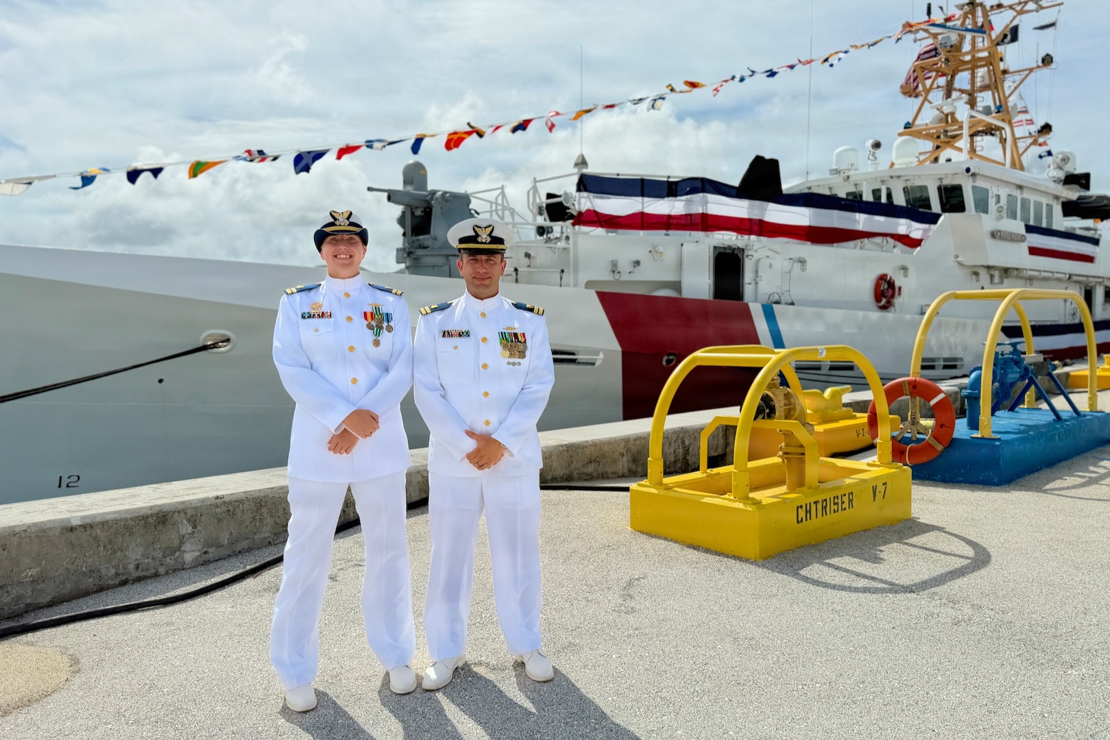 Lt. Drew Lovullo assumes command of USCGC Myrtle Hazard (WPC 1139) from Lt. Emma Saunders in a change of command ceremony on Victor Wharf in Guam on July 17, 2026. Capt. Jessica Worst, commander of U.S. Coast Guard Forces Micronesia/Sector Guam, presided over the ceremony. Under Saunders' command, Myrtle Hazard’s crew recently delivered roughly 20,000 pounds of relief supplies to five islands across the Commonwealth of the Northern Mariana Islands after Super Typhoon Sinlaku, carrying the mayor of Agrihan and Pagan to his constituents and moving equipment for Navy partners. Weeks later, after Super Typhoon Bavi, the crew ferried aids to navigation and Navy Explosive Ordnance Disposal teams across the Marianas, running sonar assessments off Rota and supporting the assessments that reopened the ports of Tinian and Rota. (U.S. Coast Guard photo by Lt. Sara Muir)