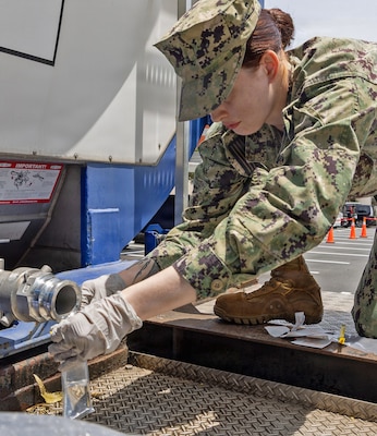 YOKOSUKA, Japan (June 16, 2026) Hospital Corpsman 3rd Class Casandra Tisdale, a preventive medicine technician assigned to U.S. Naval Hospital Yokosuka's Directorate for Public Health (DPH) collects a water sample from a tanker. DPH collected samples from multiple locations across the installation to support water quality testing following repairs to the installation's water distribution system. (U.S. Navy photo by Daniel Taylor/USNH Yokosuka Public Affairs)