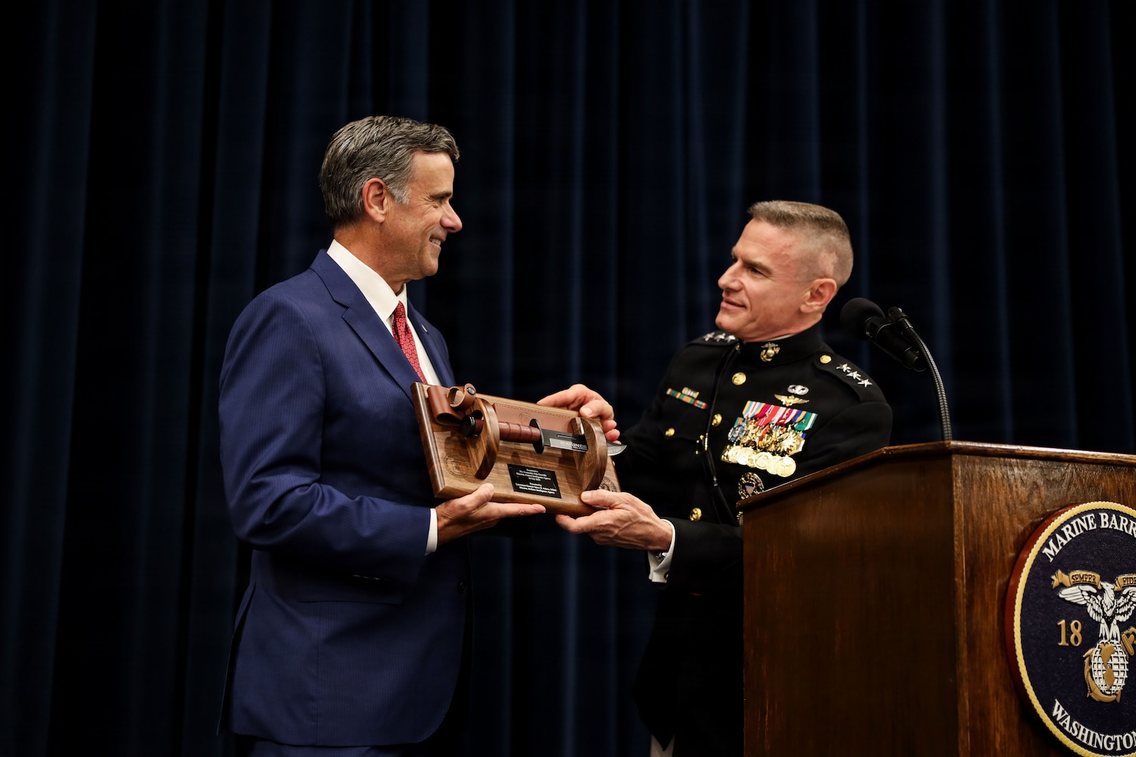 DIA Director Lt. Gen. James Adams presents guest of honor CIA Director John Ratcliffe with a gift preceding the Marine Barracks Parade in Washington, D.C., (U.S. Marine Corps photo by Lance Cpl. Landon Heredia).